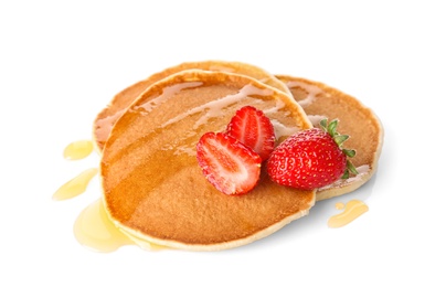 Tasty pancakes with maple syrup and fresh berries on white background