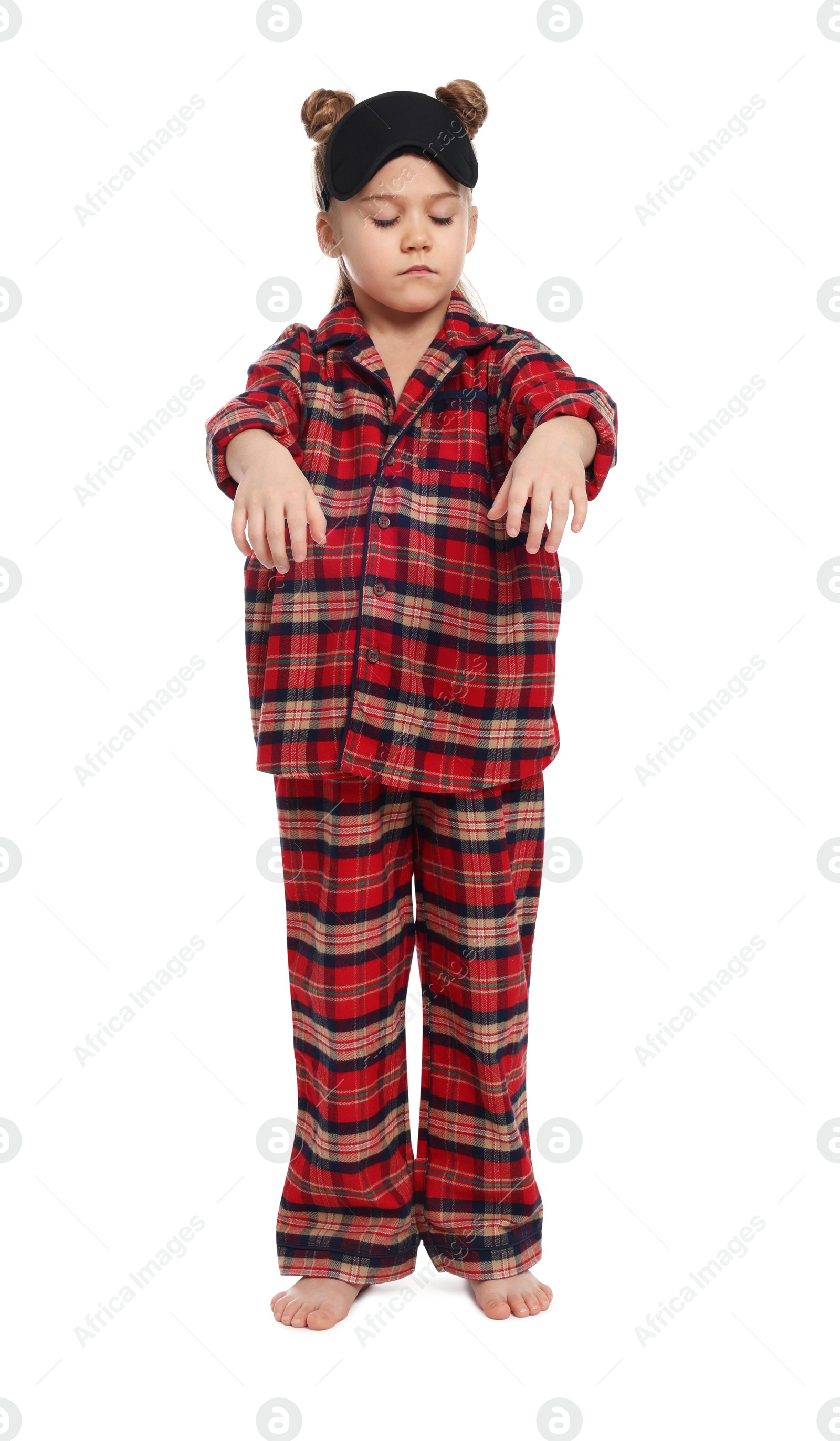 Photo of Girl in pajamas and sleep mask sleepwalking on white background