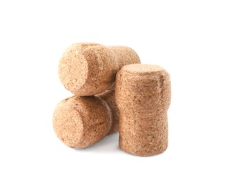 Photo of Many sparkling wine corks on white background