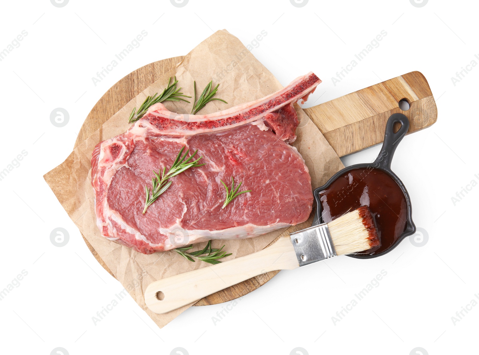 Photo of Board with raw meat, rosemary and marinade isolated on white, top view