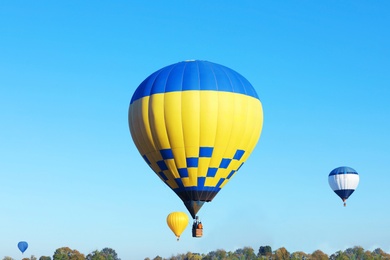Photo of Beautiful view of hot air balloons in blue sky