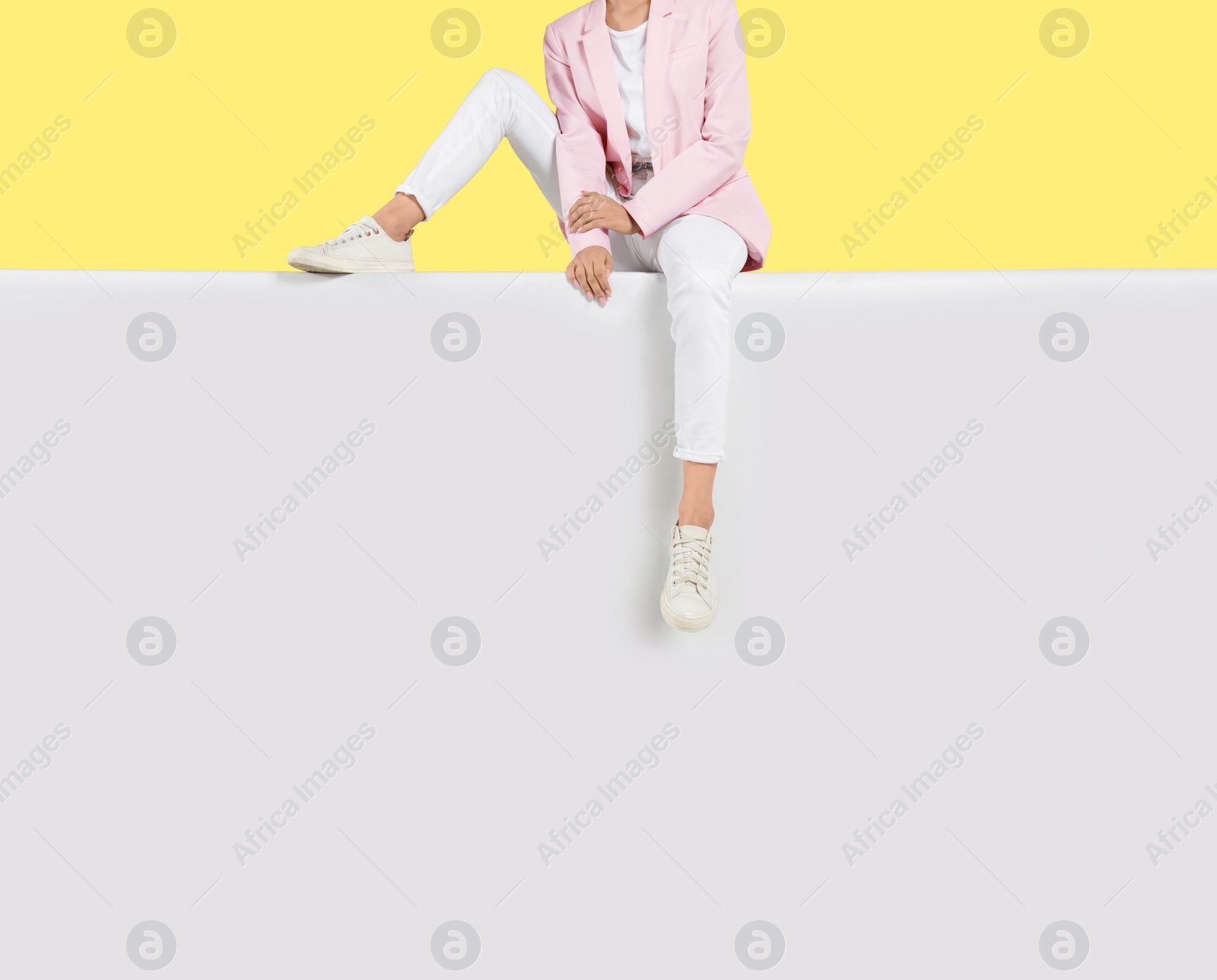 Photo of Woman wearing stylish shoes on color background, closeup