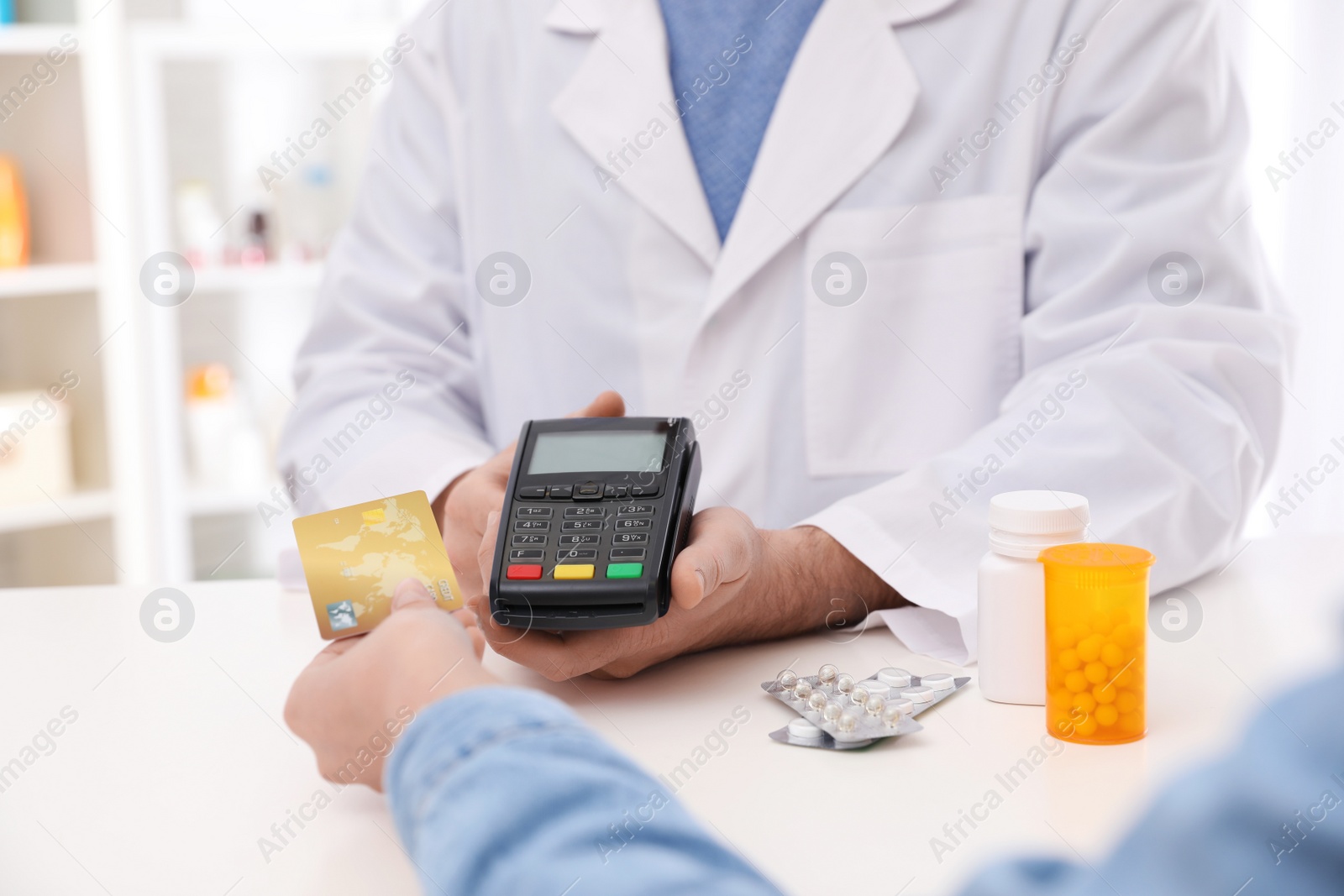 Photo of Client using credit card for terminal payment in pharmacy, closeup