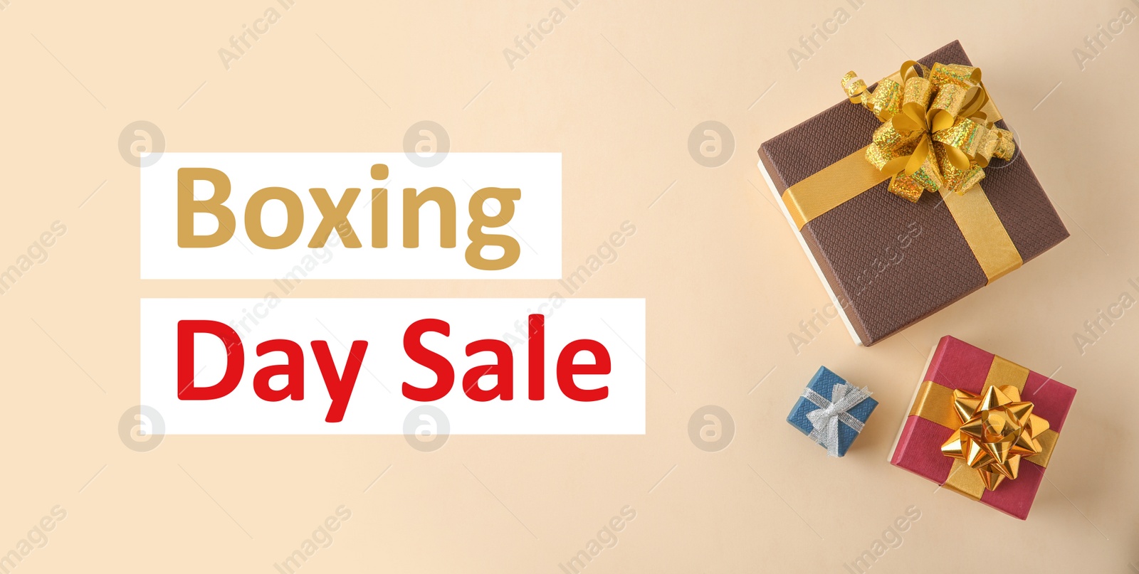 Image of Boxing day sale. Top view of gifts on light background, banner design