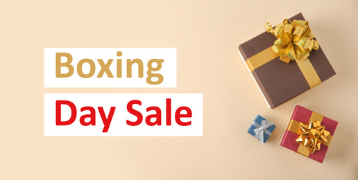 Boxing day sale. Top view of gifts on light background, banner design