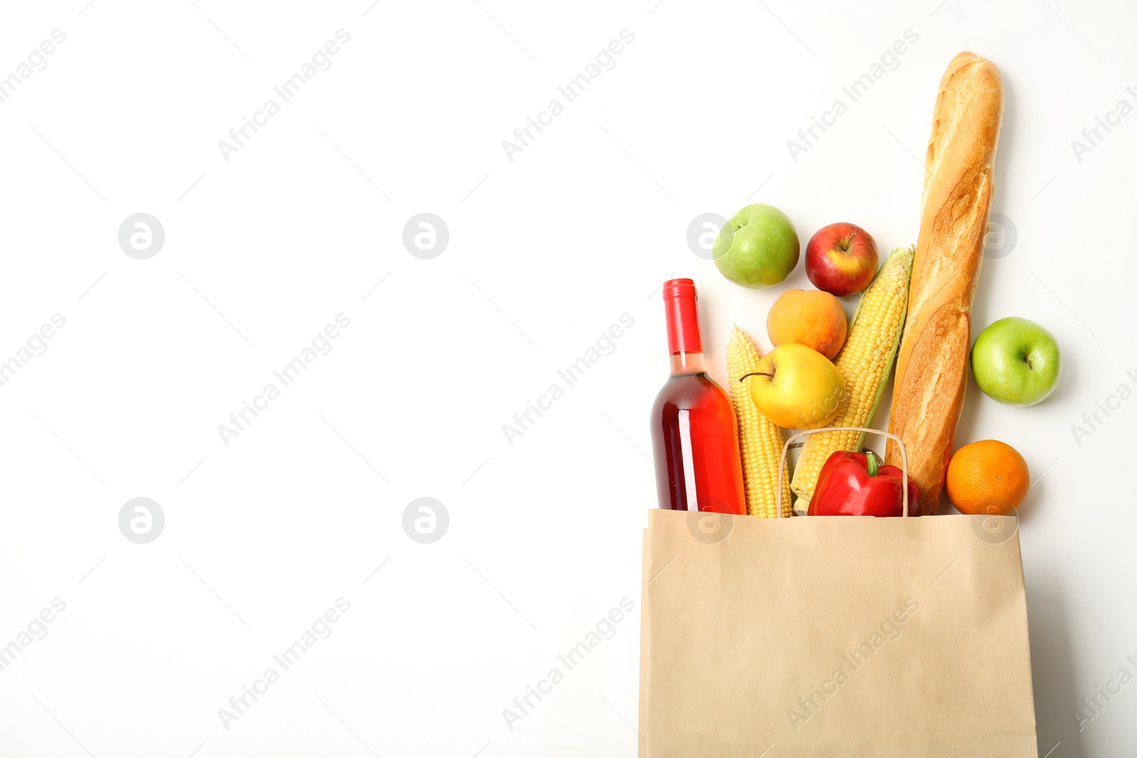 Photo of Flat lay composition with shopping bag and products on white background