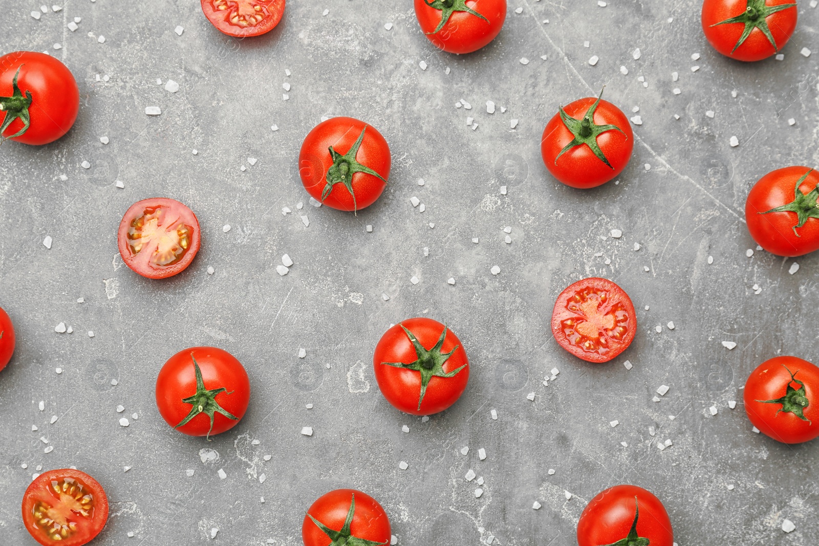 Photo of Flat lay composition with ripe tomatoes on grey background