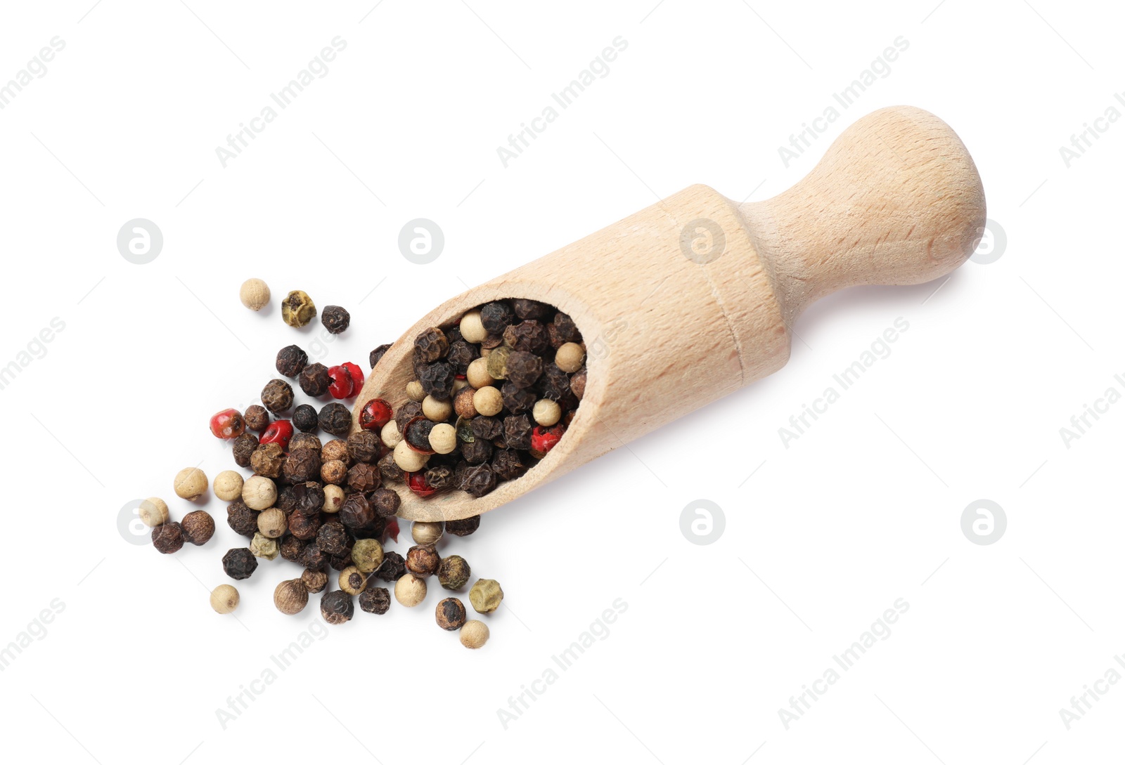 Photo of Aromatic spices. Different peppers and wooden scoop isolated on white, top view