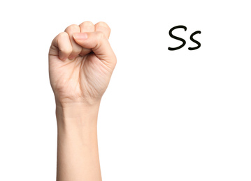 Woman showing letter S on white background, closeup. Sign language