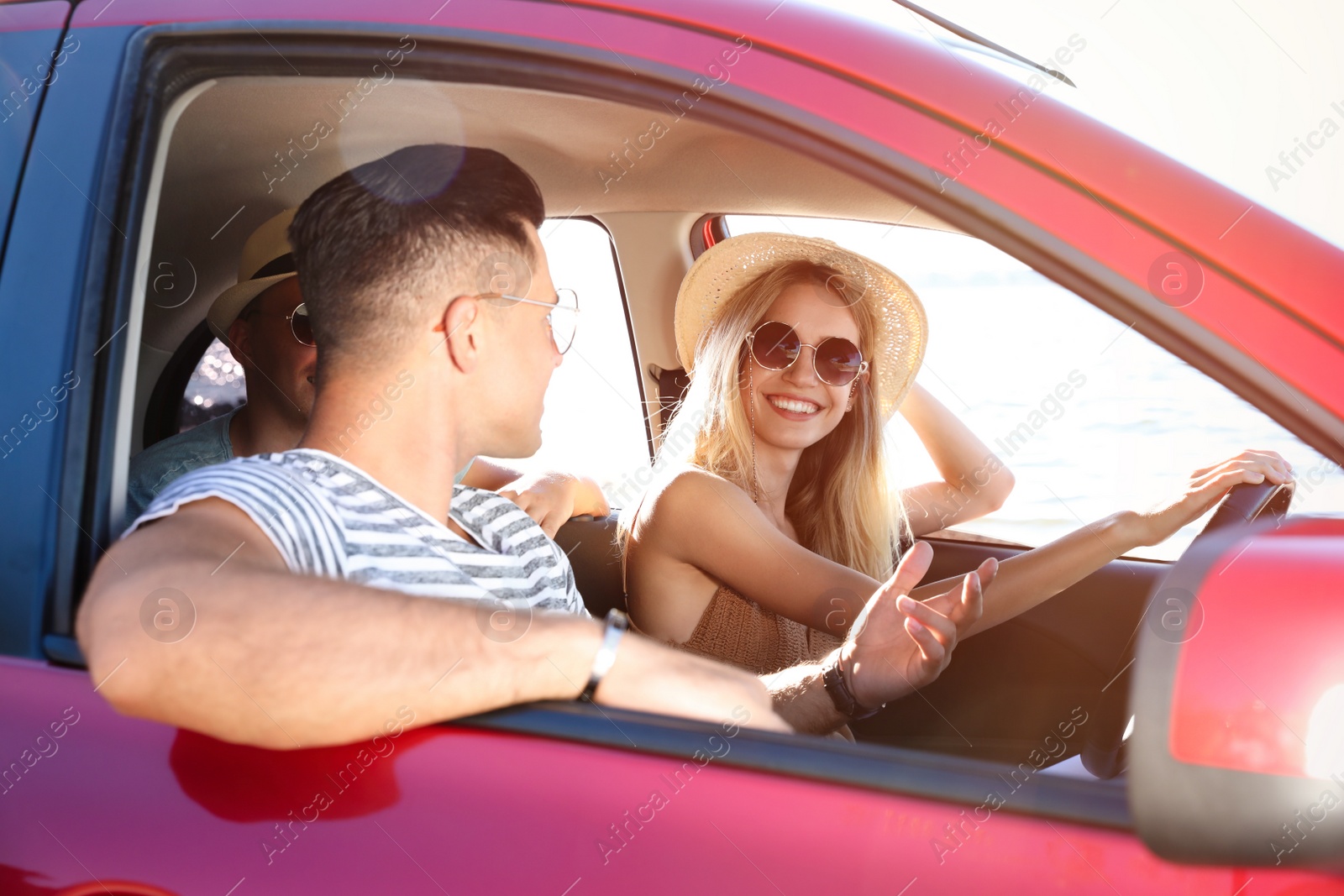 Photo of Happy friends together in car on road trip