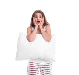 Young woman in pajamas with pillow on white background