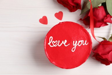 Photo of Bento cake with text Love You, roses, paper hearts and space for text on white wooden table, flat lay. St. Valentine's day surprise