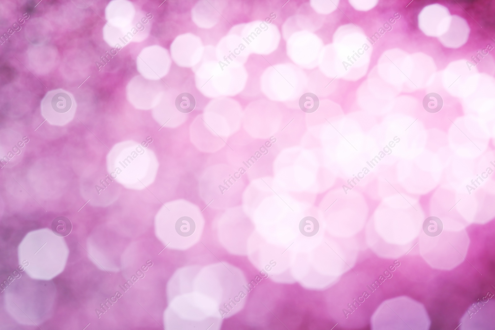 Photo of Bright magic pink bokeh effect as background