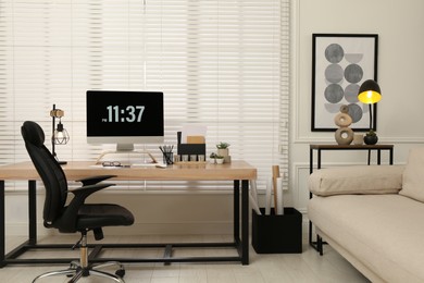 Photo of Home office interior with comfortable workplace near window