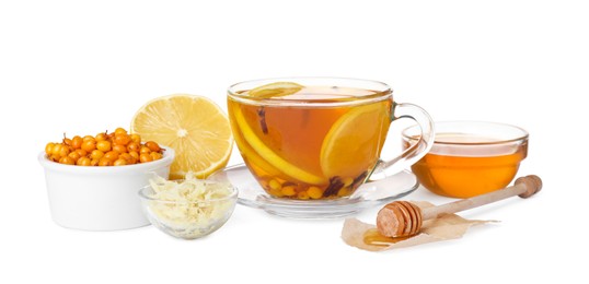 Glass cup of immunity boosting drink and ingredients on white background