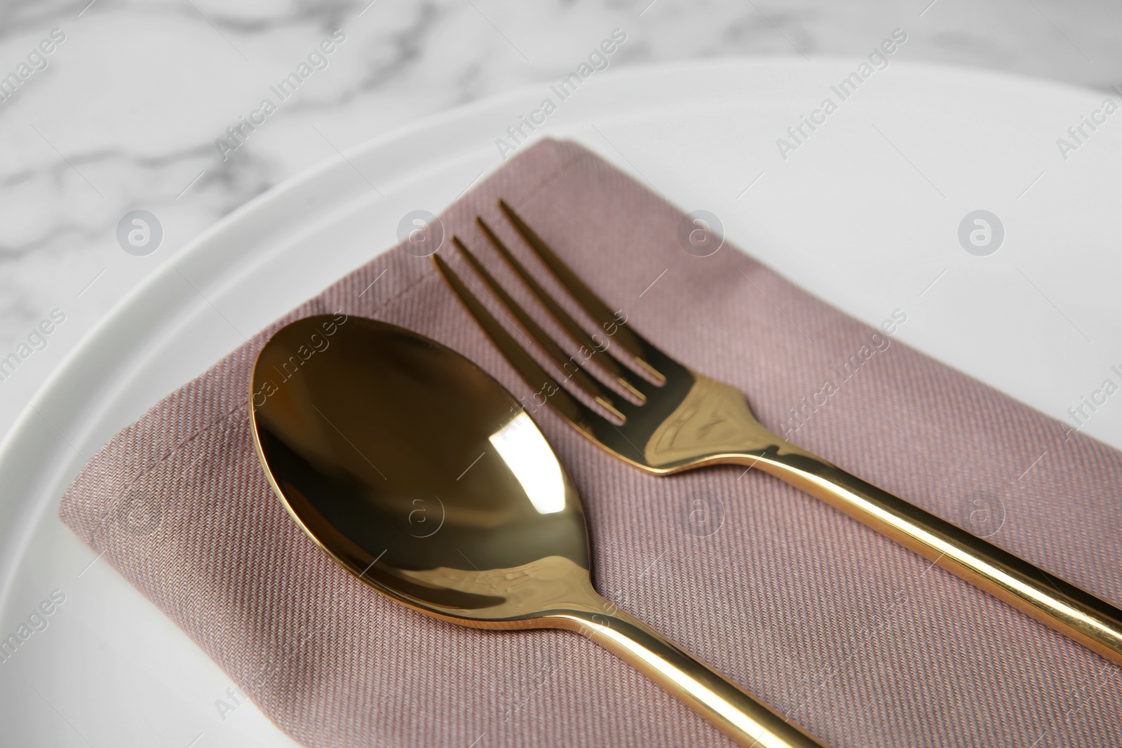 Photo of Beautiful table setting on white marble background, closeup