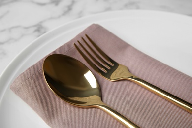 Photo of Beautiful table setting on white marble background, closeup