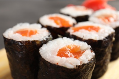 Photo of Tasty sushi rolls, closeup view. Food delivery