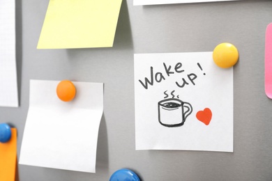 Photo of Note with text "Wake up" and empty sheets on refrigerator door. Space for text