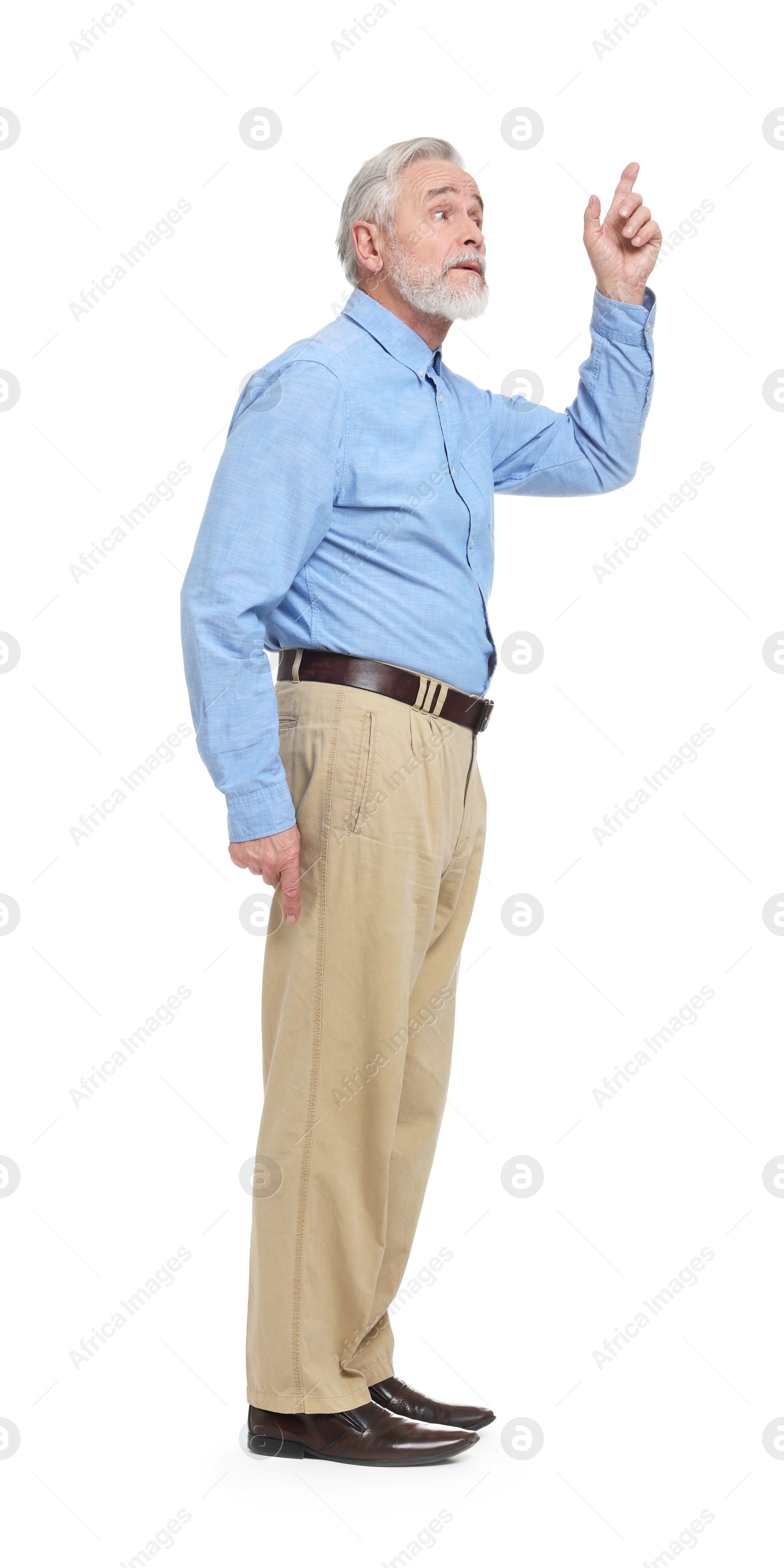 Photo of Senior man pointing at something on white background