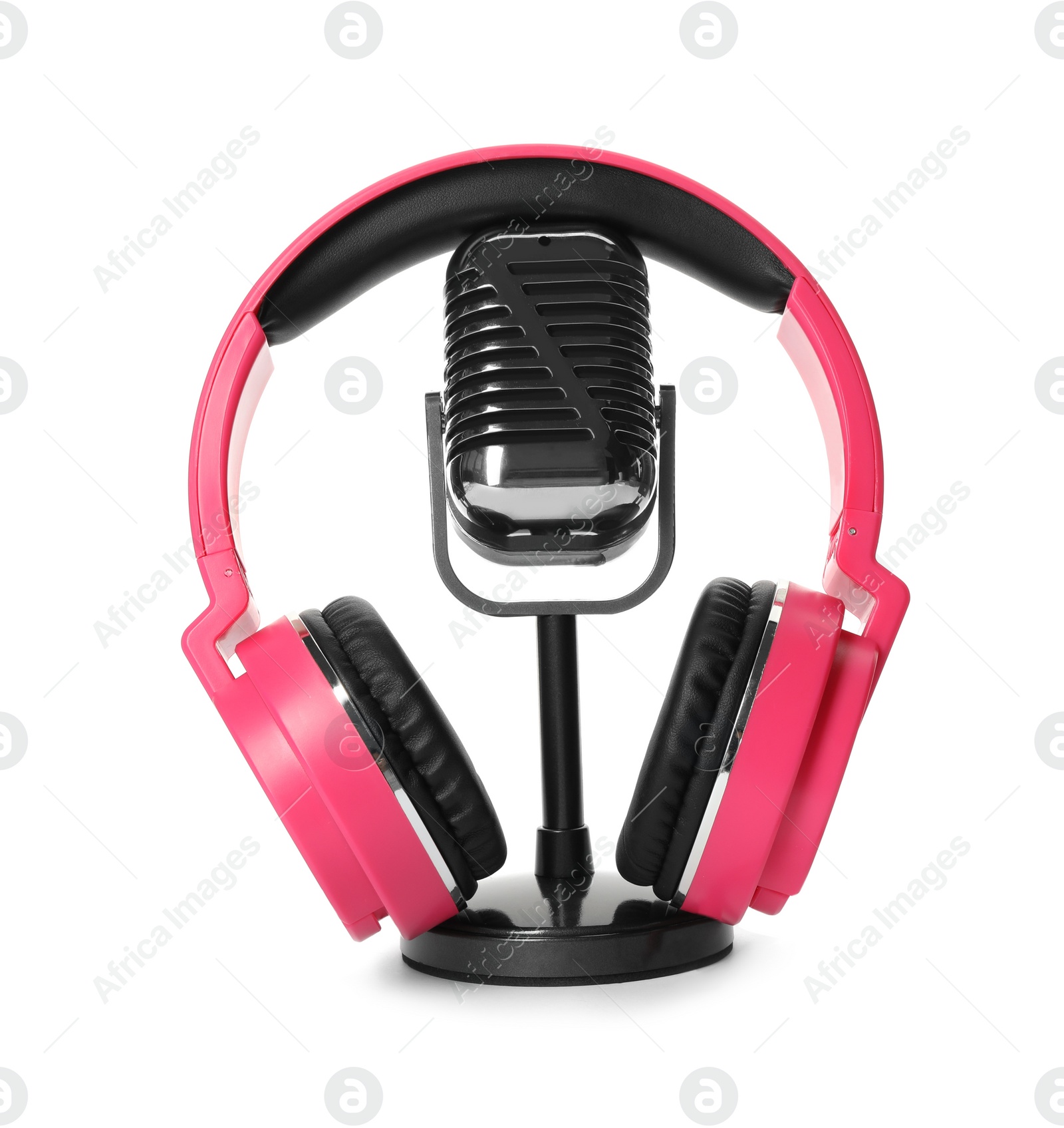 Photo of Retro microphone and headphones on white background