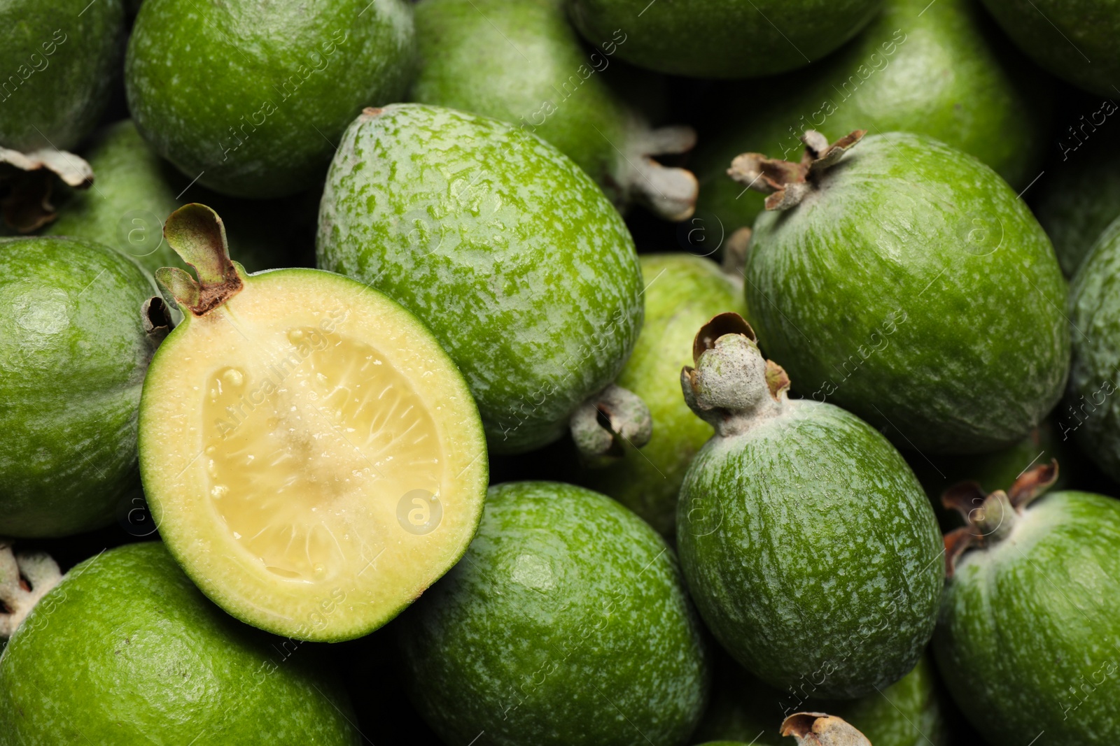 Photo of Fresh green feijoa fruits as background, closeup