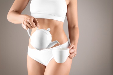 Photo of Young woman pouring diet tea into cup on beige background, closeup