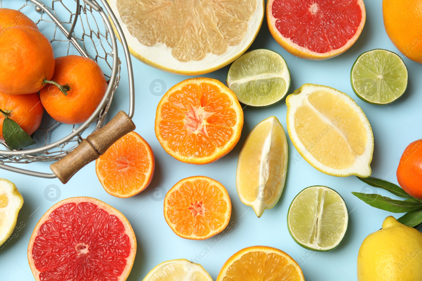 Photo of Different citrus fruits on color background, top view