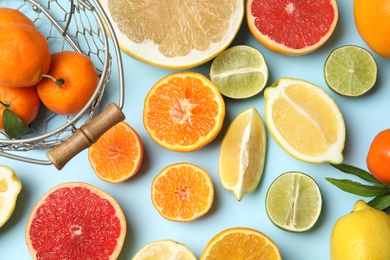 Photo of Different citrus fruits on color background, top view