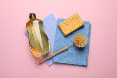 Photo of Composition with sponge and other cleaning supplies on pink background, top view