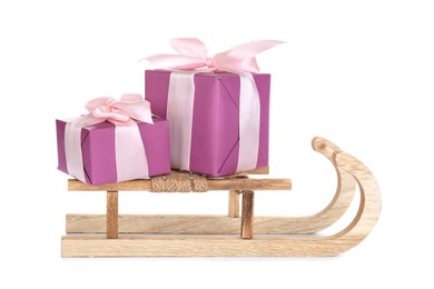 Wooden sleigh with presents on white background. Christmas holiday decor