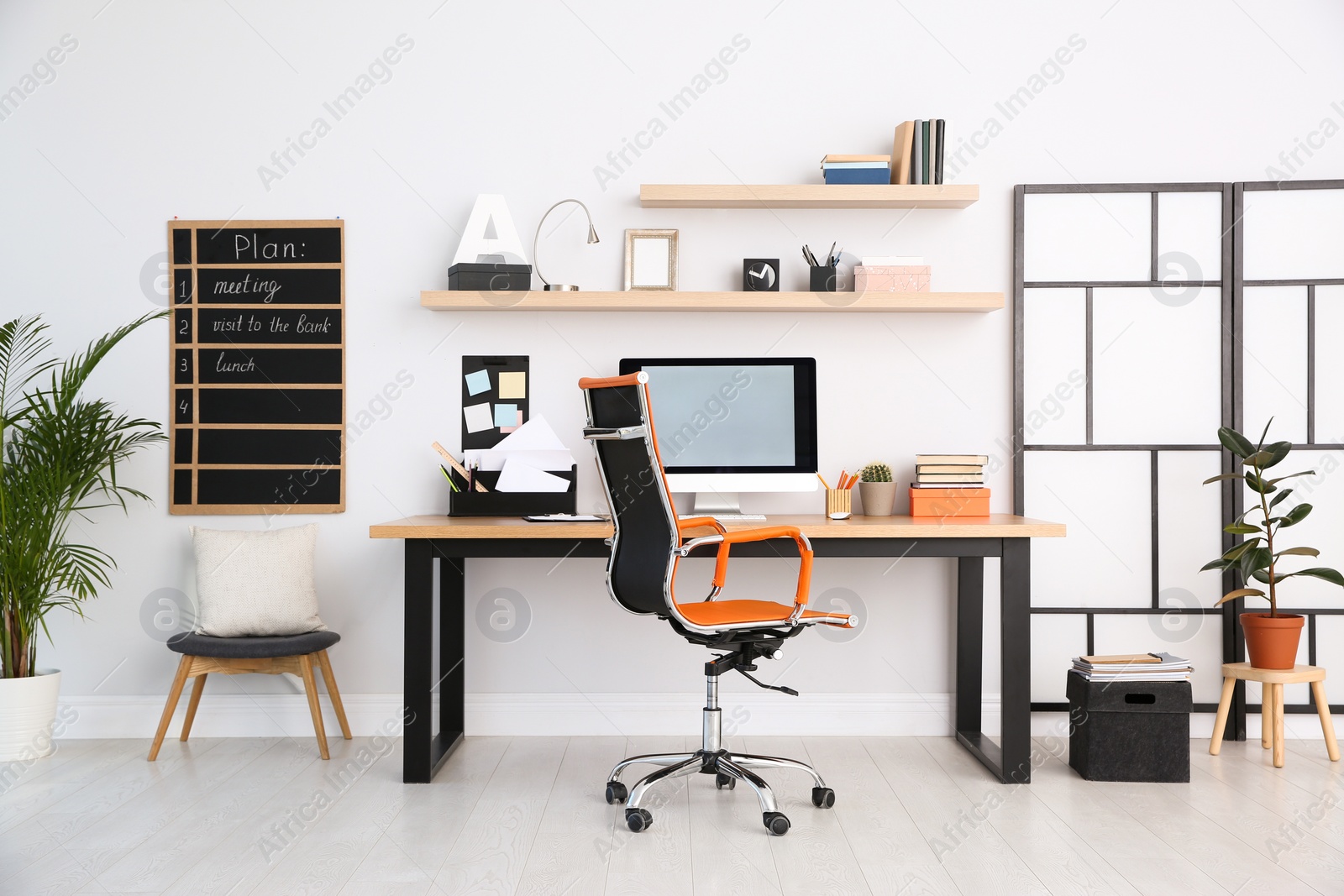 Photo of Modern computer on table in office interior. Stylish workplace