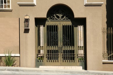 Entrance of house with beautiful door and metal gate