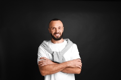 Portrait of handsome man on black background