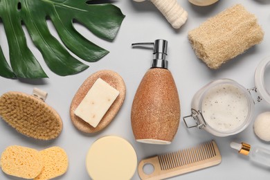 Bath accessories. Flat lay composition with personal care products on light grey background