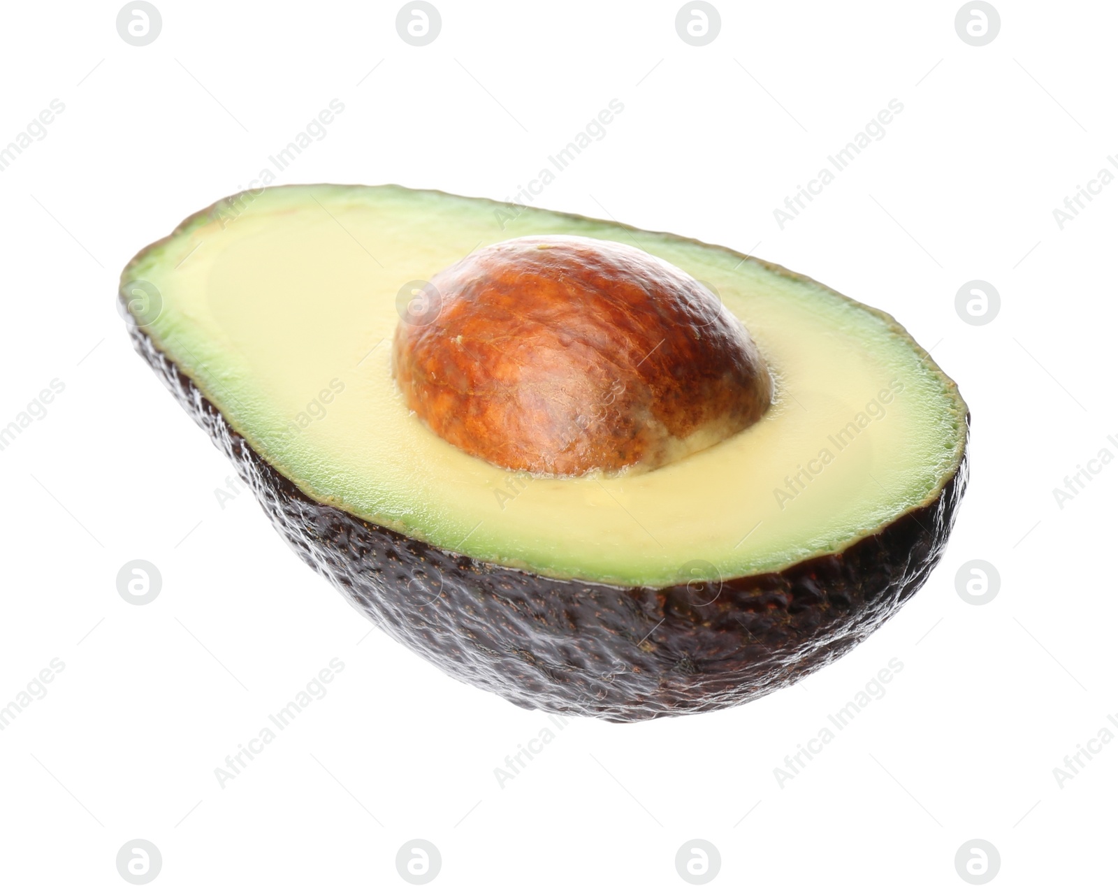 Photo of Half of ripe avocado with pit isolated on white