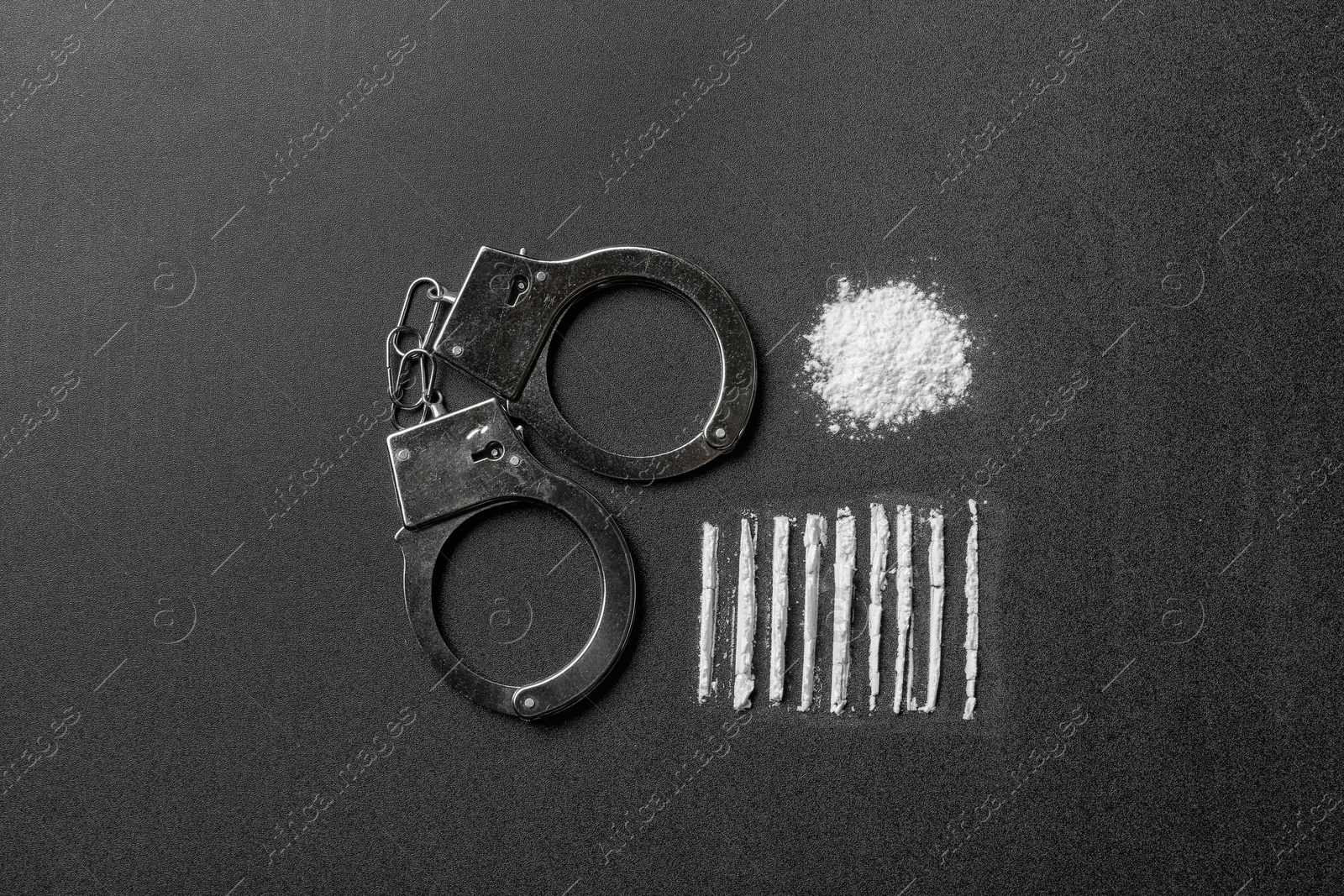 Photo of Flat lay composition with cocaine and handcuffs on black background