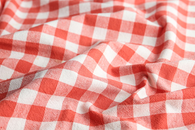 Photo of Texture of red checkered fabric as background, closeup