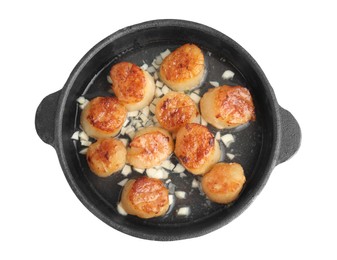 Delicious fried scallops in pan isolated on white, top view