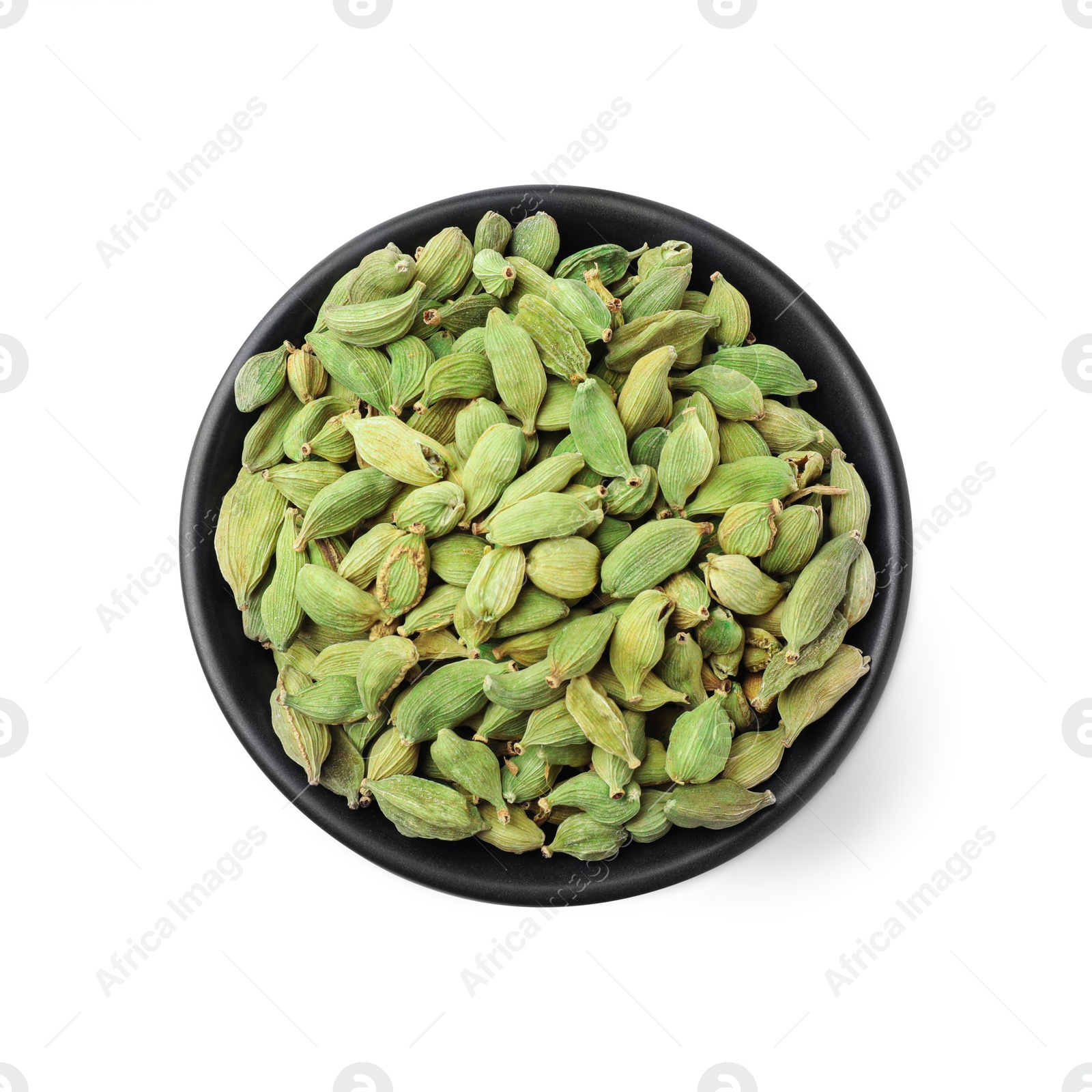 Photo of Ceramic bowl with dry cardamom seeds isolated on white, top view