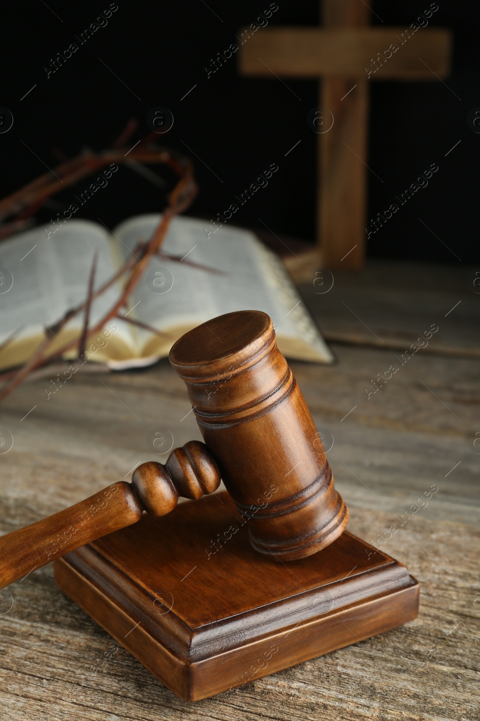 Photo of Judge gavel on old wooden table, closeup