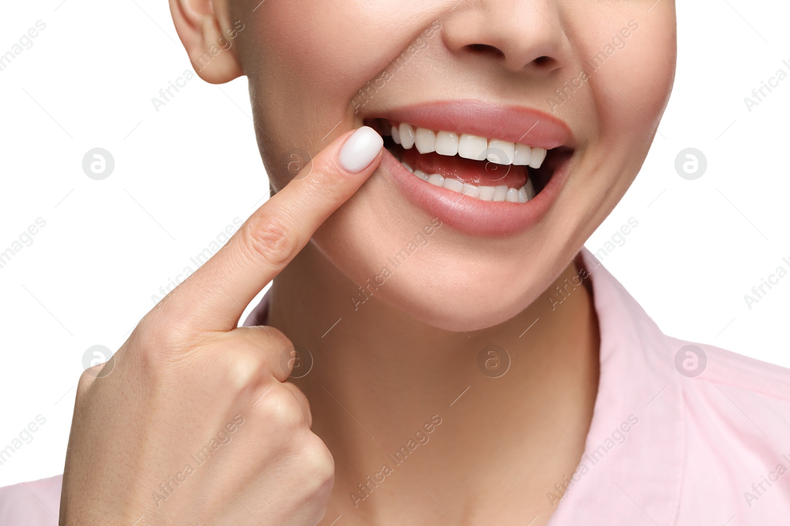 Photo of Woman showing her clean teeth and smiling on white background, closeup