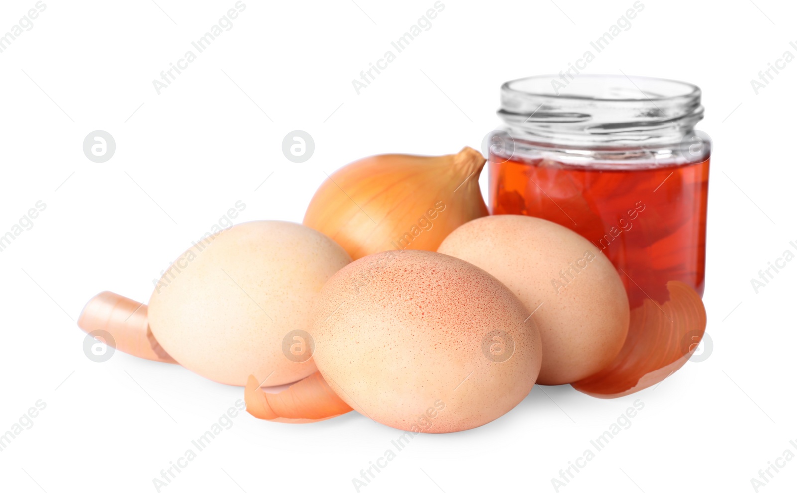 Photo of Easter eggs painted with natural dye and onion on white background