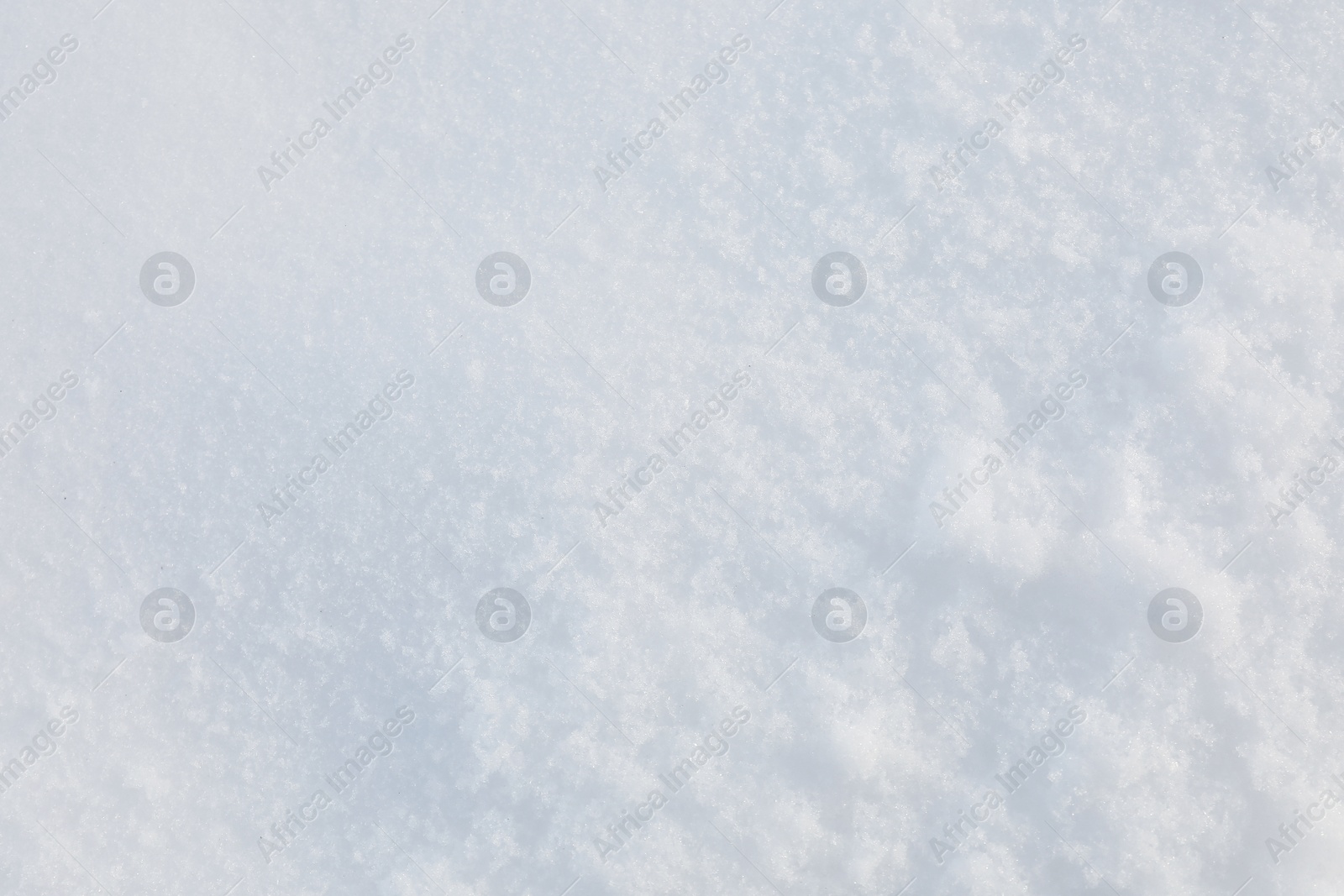 Photo of Clear white snow as background, closeup. Winter season