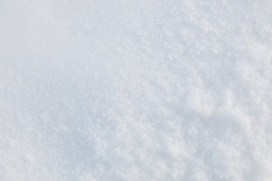 Photo of Clear white snow as background, closeup. Winter season