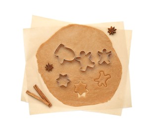 Photo of Dough and cookie cutters on white background, top view. Christmas biscuits