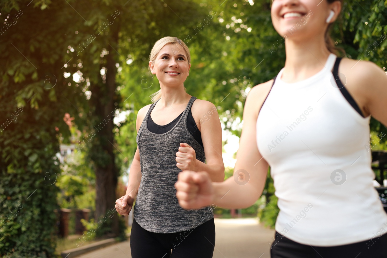 Photo of Women running on city street in morning