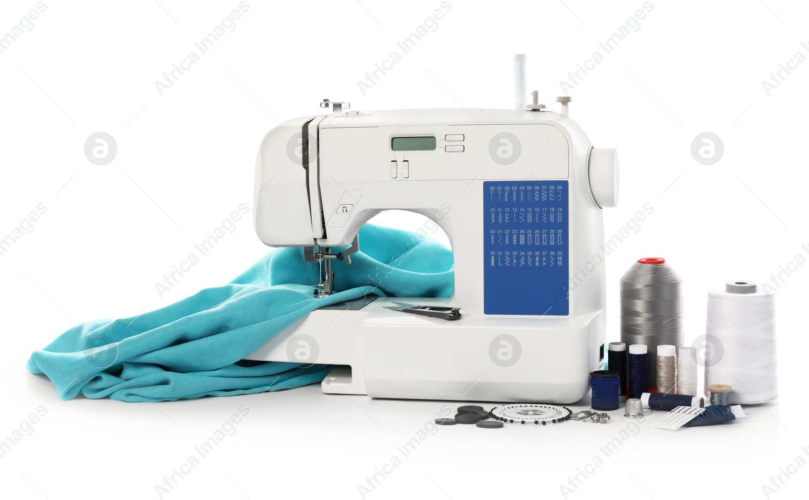 Photo of Sewing machine with fabric and craft accessories isolated on white