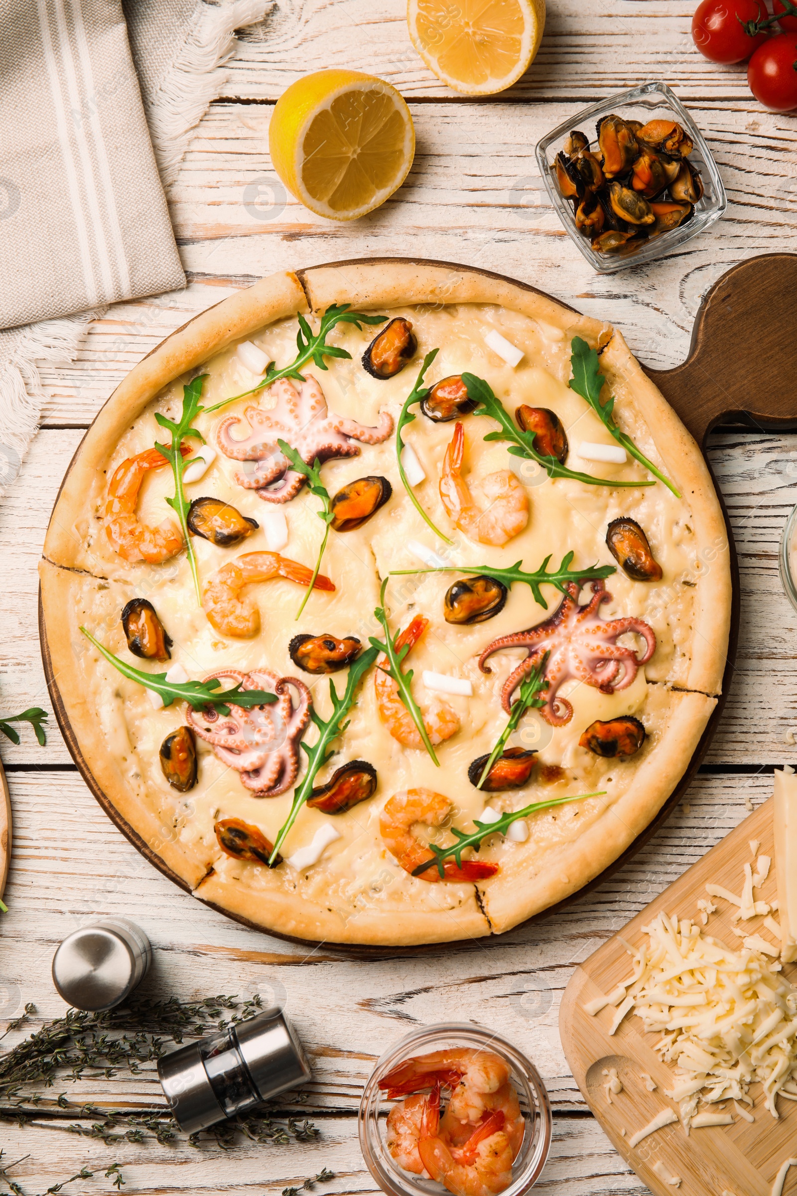 Image of Delicious seafood pizza on white wooden table, flat lay. Food photography  