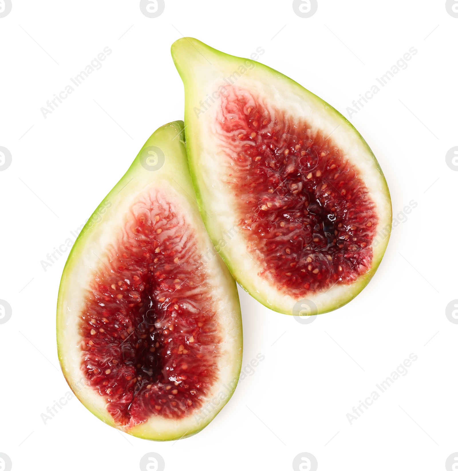 Photo of Halves of fresh green fig isolated on white, top view